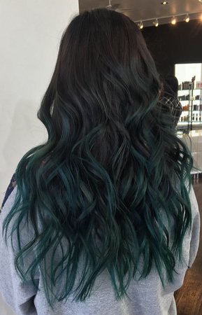 black hair with ends dyed green