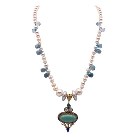 A.Jeschel Lustrous Pearls between Blue Topaz teardrops necklace.