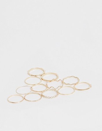 ASOS DESIGN pack of 12 rings with twist details and engraved designs in gold tone | ASOS