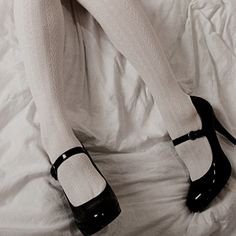 white tights black shoes on bed aesthetic alice