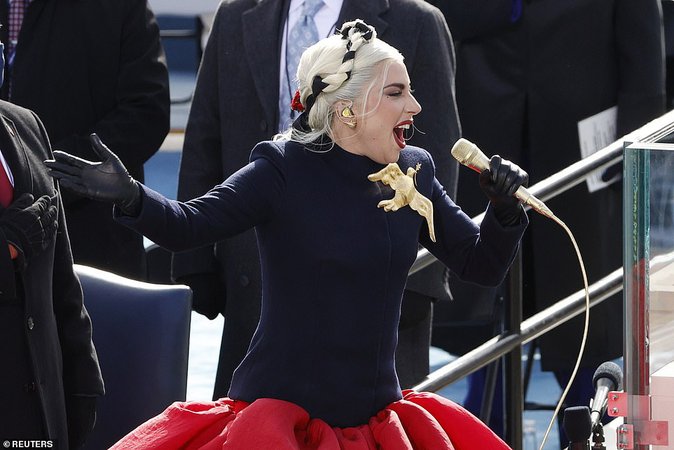 Lady Gaga makes a plea for peace in stunning gown with gold dove during her inauguration performance | Daily Mail Online