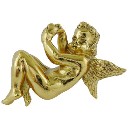 Christian Dior, Gold angel brooch