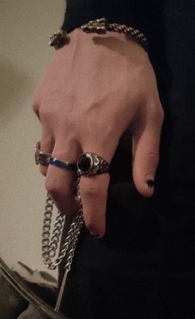 hand with ring and chain