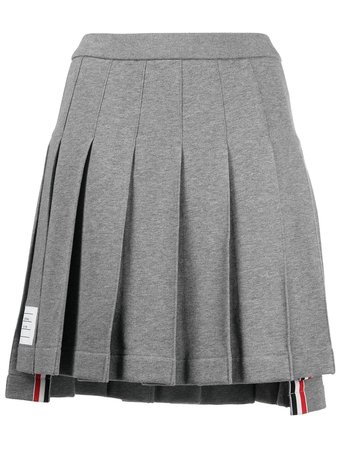 Shop Thom Browne logo patch pleated short skirt with Express Delivery - FARFETCH