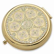 Gold compact mirror.