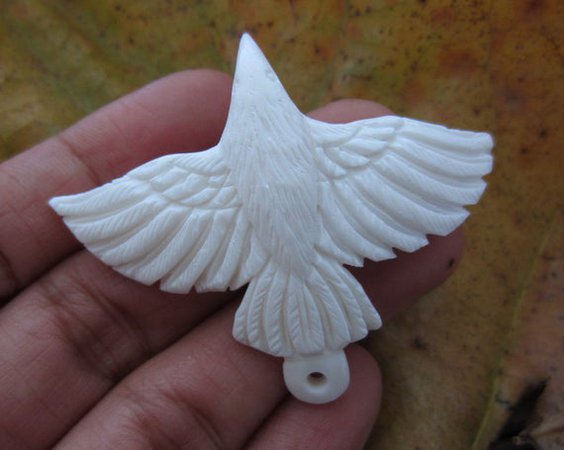 carved bone raven pendant