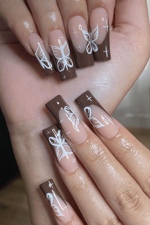 brown butterfly French tip nails