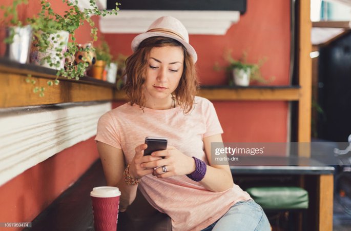 Girl at Coffee Shop - Getty Images