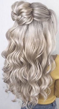 long wavy blonde hair half up half down braided bun hairstyle