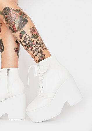pink and white wing combat boots