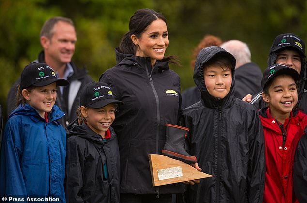 In pictures: Harry v Meghan in welly-wanging contest | Daily Mail Online