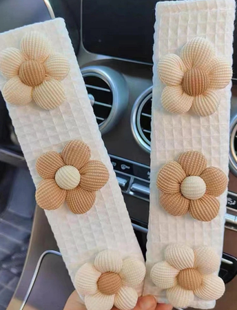 brown and cream flower seatbelt covers