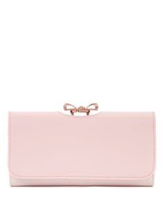 light pink clutch with bow handle