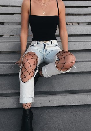 Fishnets with ripped boyfriend jeans