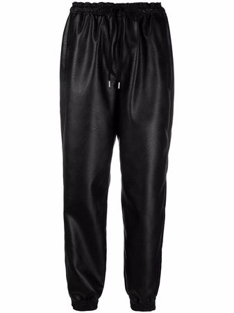 Shop Stella McCartney Kira faux leather trousers with Express Delivery - FARFETCH