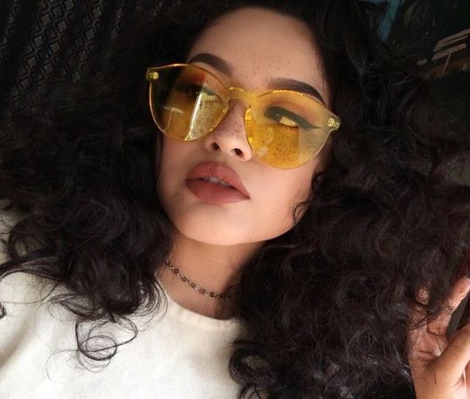 curly Afro and yellow sunglasses