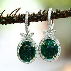 Emerald and diamond earrings with butterflies