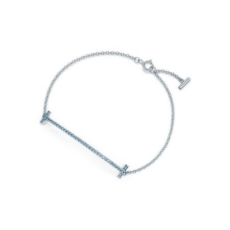 Tiffany T smile bracelet in 18k white gold with blue topaz, medium. | Tiffany & Co.