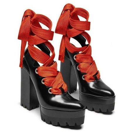 black chunky platform boots with bright Orange laces