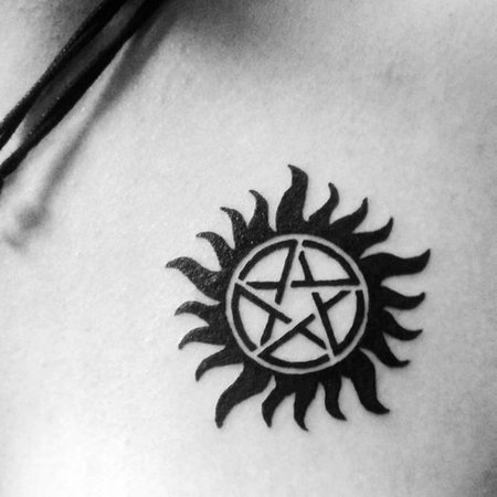anti-possession-upper-chest-black-ink-symbol-tattoo.jpg (599×599)