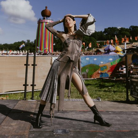Caroline Polachek on Instagram: "Been hoping for years to get to play on these hallowed leylines ❇️ thank you @glastofest photos @hredcliffe wearing @keplerlondon and…"