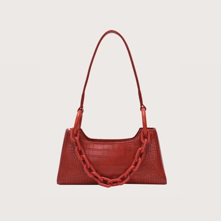 red baguette bag with red chain detailing