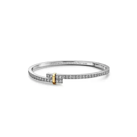 Tiffany Edge Hinged Bypass Bangle in Platinum and Yellow Gold with Diamonds | Tiffany & Co.