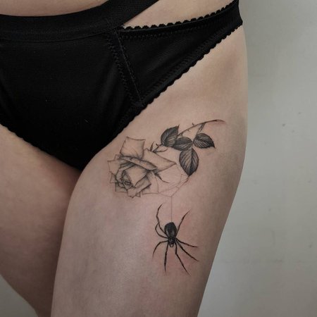 spider thigh tattoo