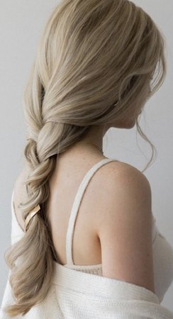 long wavy blonde hair in a loose braid hairstyle