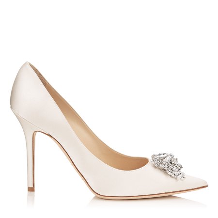 White pointed toe pumps with diamond