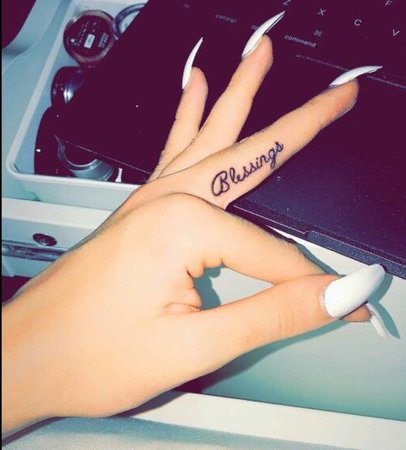 “Blessings” finger tattoo