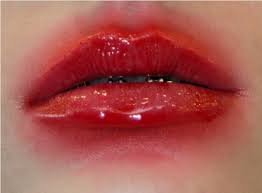 smudged red lipstick