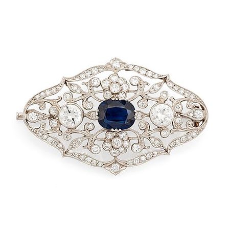A platinum brooch set with a faceted sapphire and old- and eight-cut diamonds. - Bukowskis