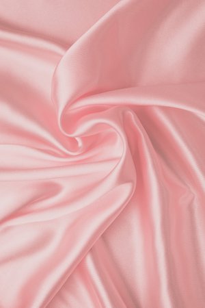 Pastel soft pink background, silk fabric pattern. abstract light wallpaper with waves of luxury textile. smooth glossy cloth, satin texture with folds. | Premium Photo