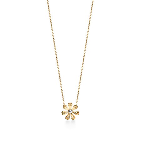 Return to Tiffany® Love Bugs daisy pendant in 18k gold and sterilng silver. | Tiffany & Co.