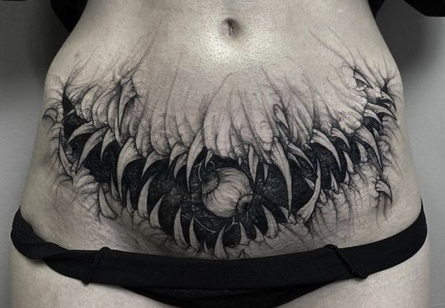 lower stomach monster tattoo
