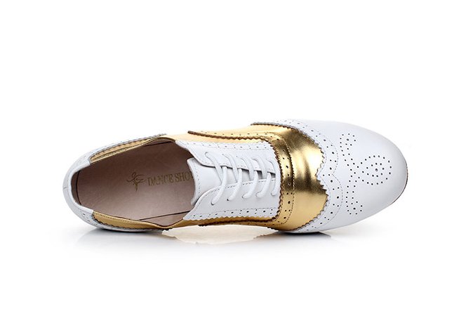 Gold and white tap dancing shoes