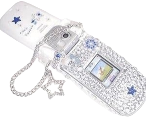 bedazzled flip phone with star charm chain