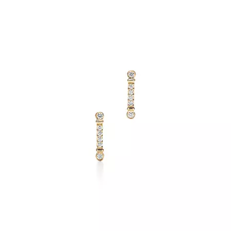 Tiffany Fleur de Lis key bar earrings in 18k gold with diamonds. | Tiffany & Co.