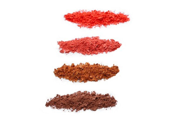Premium Photo | Makeup cosmetics. eyeshadow in brown and red colors crushed palette, colorful eye shadow powder on white background