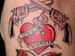 heart and gun tattoo