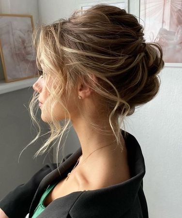 (8) Messy Updo with Face-Framing Strands