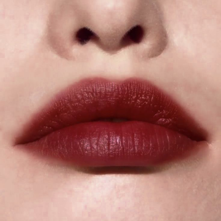 smudged red lipstick