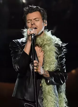 Harry Styles in a Leather Suit and Fuzzy Green Boa Is My New Religion
