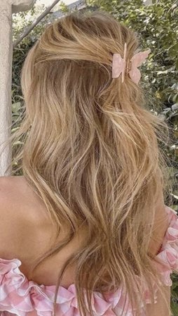 long wavy blonde hair with butterfly clip hairstyle