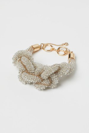 Knotted bracelet - Gold-coloured/White - Ladies | H&M IN