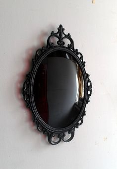 Black Convex Scrying Mirror in Vintage Oval Frame