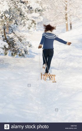 woman pulling snow sled - Google Search