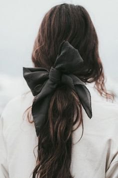 brown hair with black ribbon