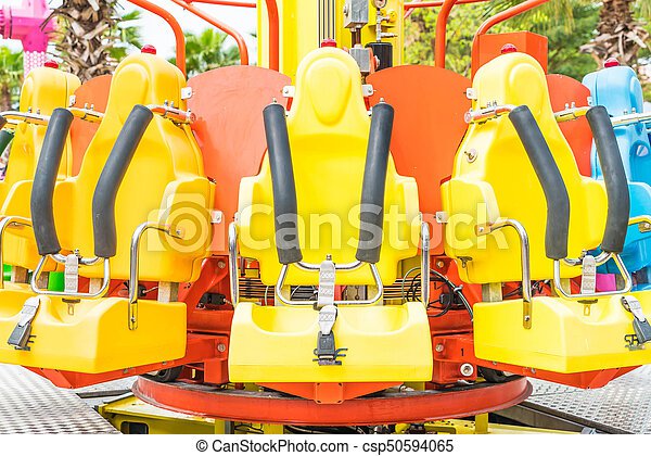 Colorful roller coaster seats at amusement park in thailand. | CanStock